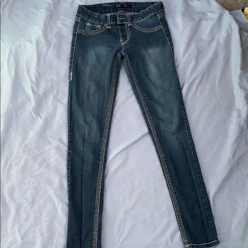 Threaded edge blue jeans.